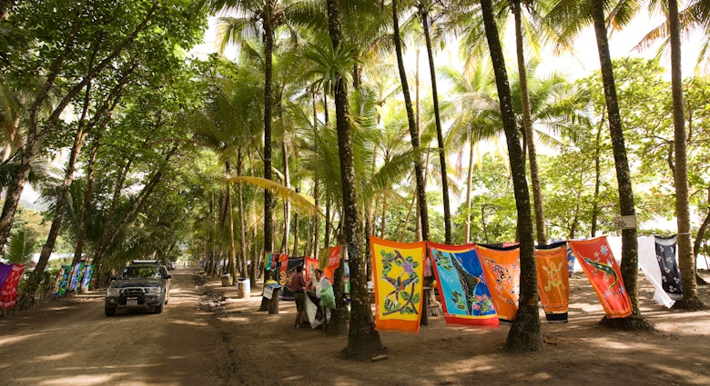 Costa Rica Dominical seafront market selling souvenirs and beach textiles
AT3TRY
Dominical, seafront, souvenir, market, beach, textiles, village, sea, seaside, beachfront, surfing, centre, center, resort, road, shade, shady, selling, colourful, colorful, towel, sarong, batik, employment, economy, economic, commerce, Costa, rica, rican, costarican, costarica, Central, America, Latin, American, travel, travelling, tourism, tourist, holiday, vacation, destination, commercial, downtown, picture, picturesque, tour, visit, visitor, trip, attraction, view, scene, scenery, scenic