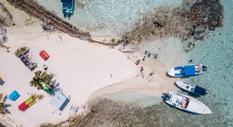 Aerial photo of tour boats anchored off South Silk Caye in the Gladden Spit and Silk Cayes Marine Reserve in Belize on March 12, 2023, License Type: media, Download Time: 2025-01-27T19:51:40.000Z, User: Ppeterson948, Editorial: true, purchase_order: 56530 - Guidebooks, job: Global Publishing WIP, client: Global Publishing WIP, other: Pia Peterson Haggarty